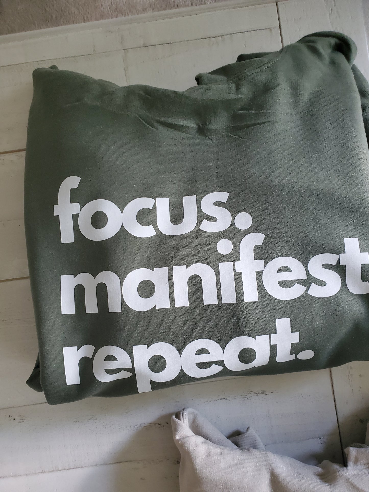 Military green hoodie focus manifest repeat