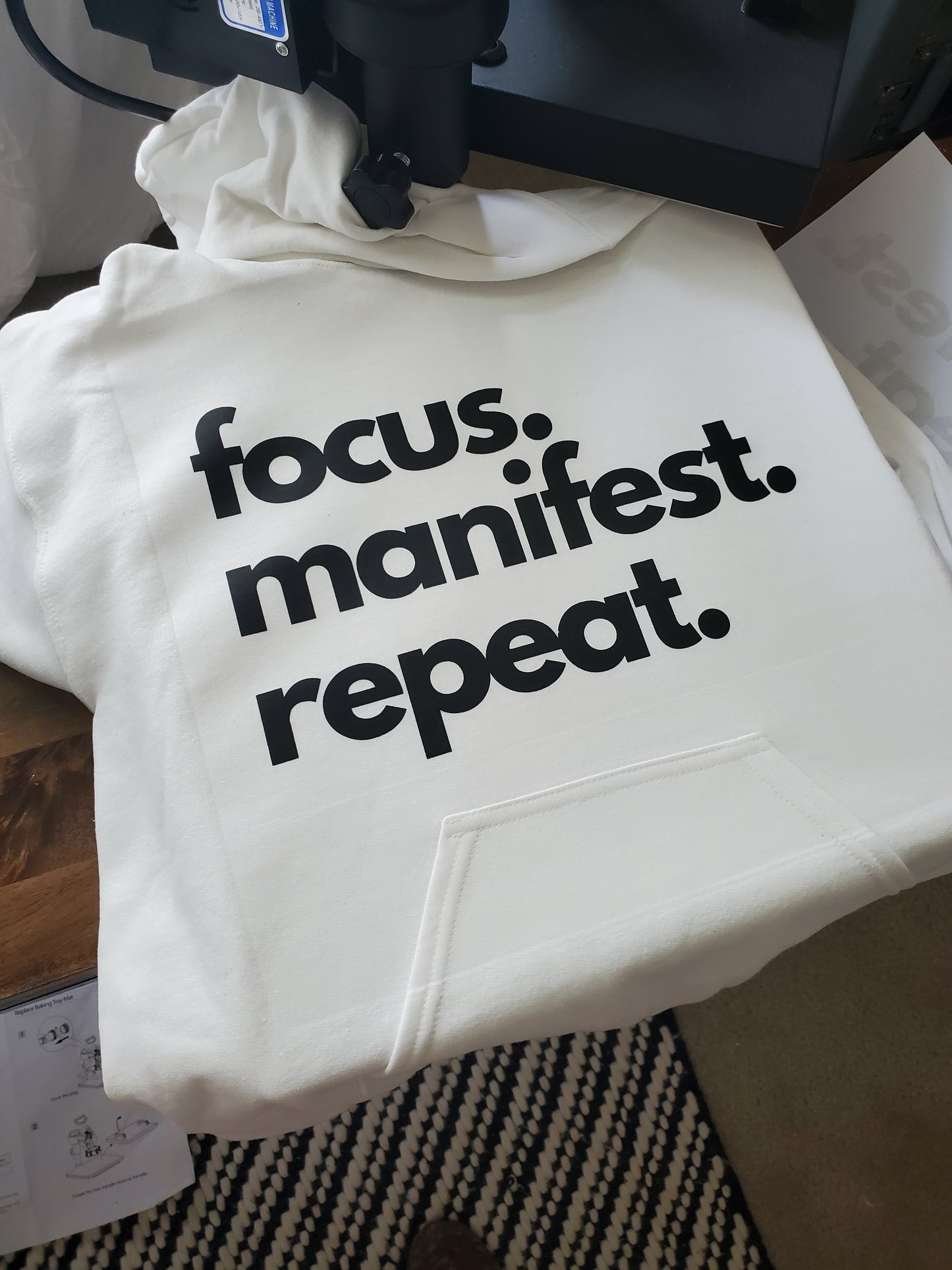 White hoodie focus manifest repeat