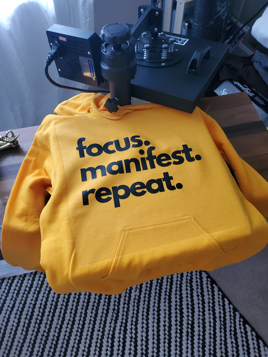 Gold hoodie focus manifest repeat